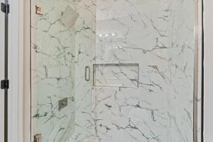 a bathroom with a marble shower with a glass door at G - Atlanta Luxury 1bdr 1bath ensuite shared Condo in prime location in Atlanta