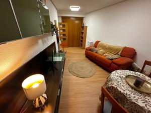 a living room with a couch and a table at EL PASEO DEL DUERO in Zamora