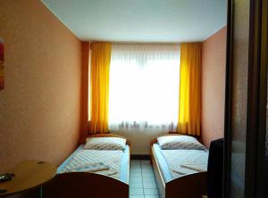 Cama o camas de una habitación en Hotel Yans