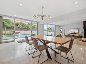 a dining room with a table and chairs at Luxury Coastal Home - Pool, Spa, AC, & Ocean Views in Solana Beach