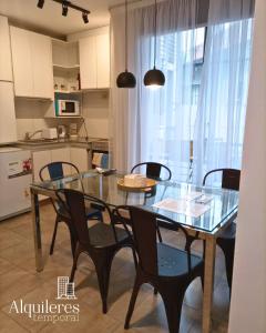 a dining room table and chairs in a kitchen at m boero 3231 in Rosario
