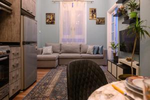 a living room with a couch and a table at The place4 Downtown Nest apartment in Cairo