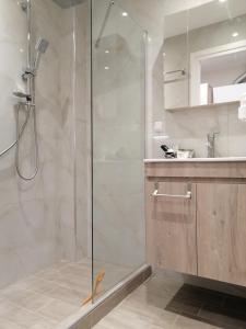 a bathroom with a shower and a sink at Central suite on Clock Square D1 in Veria