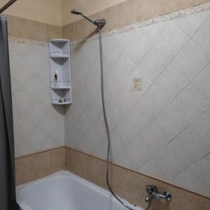 a shower in a bathroom with a bath tub at Daniele's home close to Rome in Pomezia
