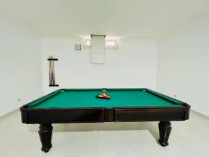 a green pool table in a room with afits at Kishni, peaceful and luxury suite villa in Arrecife