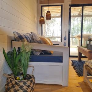 a tiny house with a bunk bed in a room at Juanillo's ll in Punta Del Diablo