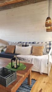 a living room with a couch and a table at Juanillo's ll in Punta Del Diablo
