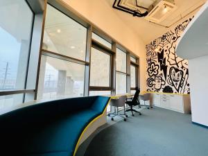 a meeting room with a table and chairs in a building at Central Station Loft - Amazing View in City Center - jupihome in Vienna