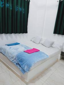 Ένα ή περισσότερα κρεβάτια σε δωμάτιο στο Magic Place Luxor