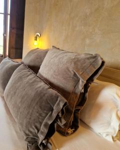 a large pillow on a bed in a bedroom at Ca n'Heras in Canet de Adri