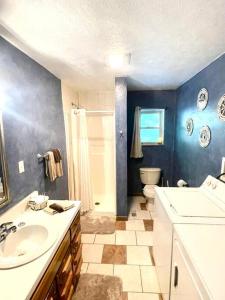 a bathroom with a sink and a toilet at Getaway to a very private beautiful Cabin. in Kyles Ford +18 photos