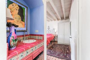 a bathroom with a sink in a room at Casa de la Vista in San Miguel de Allende