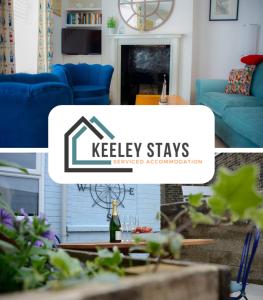 a living room with a blue couch and a table at Jewel Pier *2 Bed House* Deal in Deal