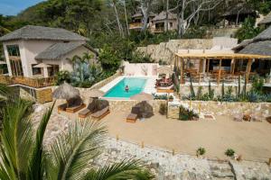 an aerial view of a pool at a resort at La Joya Sayulita in Sayulita