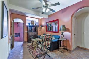 a living room with a couch and a tv at Casas Artistas in San Miguel de Allende