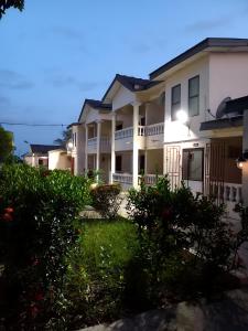 a row of houses at night at Lord's Hands Guesthouse Hotel in Winneba