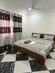 Кровать или кровати в номере Yamzo's Apartments