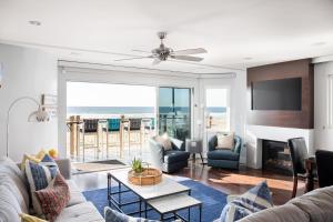 a living room with a view of the ocean at Oceanfront, two-level condo with stunning view, decks, fast WiFi & fireplace in San Diego