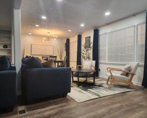 a living room with a couch and a table at Secret garden at Stone Mountain in Stone Mountain