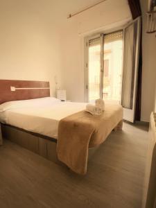 Postel nebo postele na pokoji v ubytování LÀtic Rooms