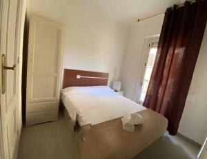 Postel nebo postele na pokoji v ubytování LÀtic Rooms