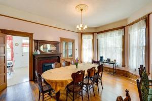 a dining room with a table and chairs and a fireplace at Lodi Hill House in Lodi