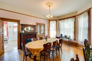 a dining room with a table and chairs and a fireplace at Lodi Hill House in Lodi