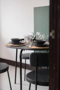 a table with glasses and plates on top of it at Apartment in Warwick - Families - Business - Contractors in Warwick