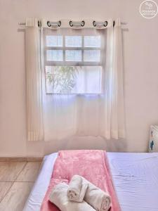 En eller flere senge i et værelse på Pousada Grão de Areia