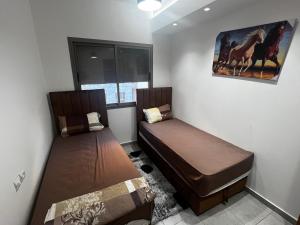 Katil atau katil-katil dalam bilik di Appartement neuf Ahlan 2 chambres