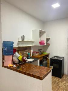 a kitchen with a counter top withtools on it at Pousada manu in Trairi