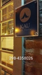 a sign for a kau waikiki on a door at Kau Del Valle in General Roca