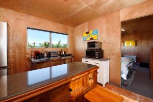 a kitchen with a counter top in a room at The shed with a view in Mahana