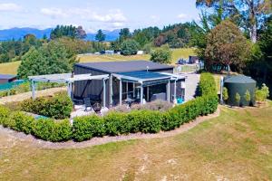 an overhead view of a house with a garden at The shed with a view in Mahana