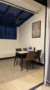 a dining room with a table and chairs at Outback Holiday Resort in Honiara