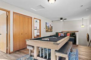 a living room with a pool table in it at Lodge at Mount Rushmore in Keystone