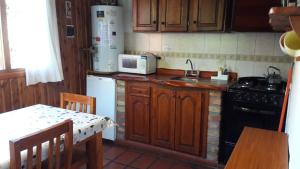 Kuchyň nebo kuchyňský kout v ubytování cabañas el águila