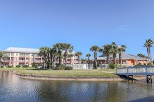 a resort with a bridge over a body of water at Seaside at Anastasia C203 in St. Augustine