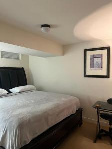 a bedroom with a bed and a picture on the wall at Atkins Investments Inc. Swanhaven in Richmond +51 photos