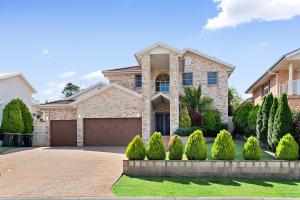 a large brick house with a garage at Shell Cove Coastal Haven in Shellharbour