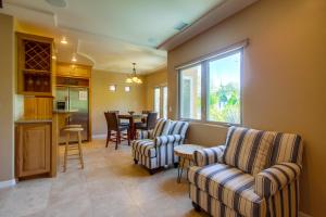 a living room with two chairs and a table at Rooftop Paradise w Private Patio, Garage & AC in San Diego