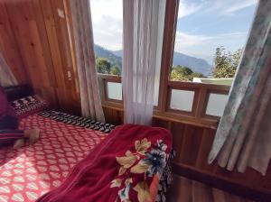 a bedroom with a bed and a large window at KACEY HOMESTAY in Pedong