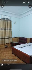 En eller flere senge i et værelse på Nhà nghỉ Hoàng Linh