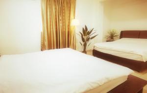 Postel nebo postele na pokoji v ubytování Cozy Suite for 2-6 pax near Kek Lok Si, Penang Hill, Sunshine Central