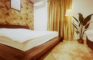 Postel nebo postele na pokoji v ubytování Cozy Suite for 2-6 pax near Kek Lok Si, Penang Hill, Sunshine Central