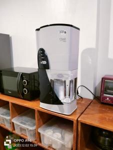 a coffee maker sitting on top of a wooden shelf at Laguna Bel-Air Home in Sta Rosa #15 by Red Door House Rental in Santa Rosa