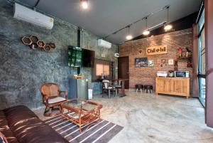 a living room with a couch and a table at Chill at Hill in Pak Chong