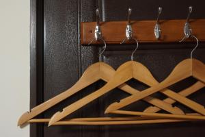 a bunch of wooden hangers in a closet at 拾穗 Ten again in Jinsha