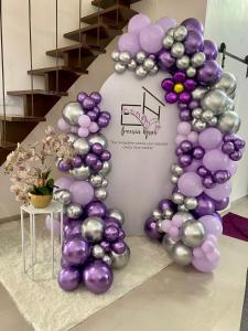 a balloon arch with purple and silver balloons at Freesia Haus in Kota Bharu +11 photos