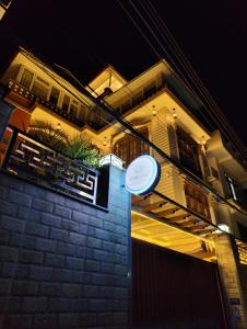 a white frisbee is sitting in front of a building at Sherpa Home Hotel in Kathmandu